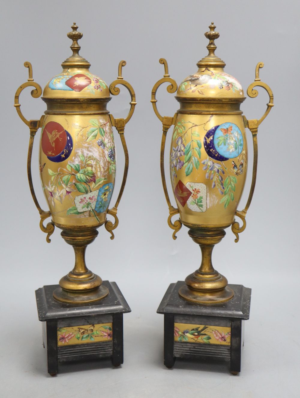 A pair of Victorian Aesthetic movement gilt metal and porcelain vases, height 40cm